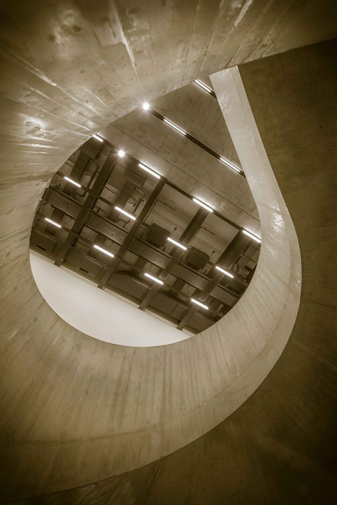 A sepia toned image of the stairwell in the Blavatnik Building. Tate Modern