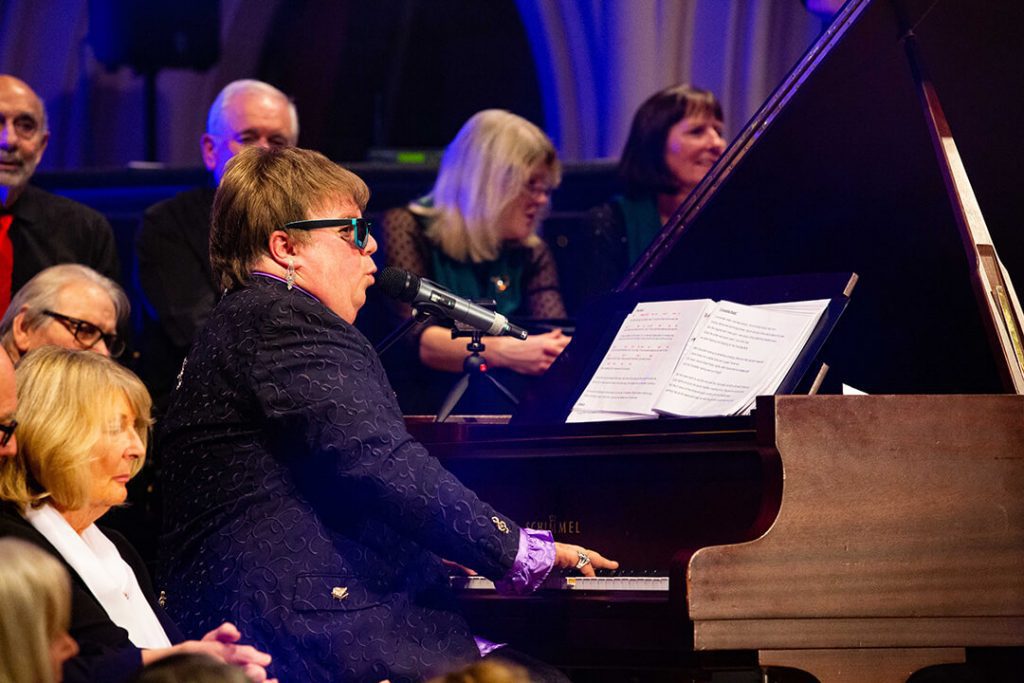 a close up view of a performance by Elton John tribute act Elite Elton at Woking's Christ Church
