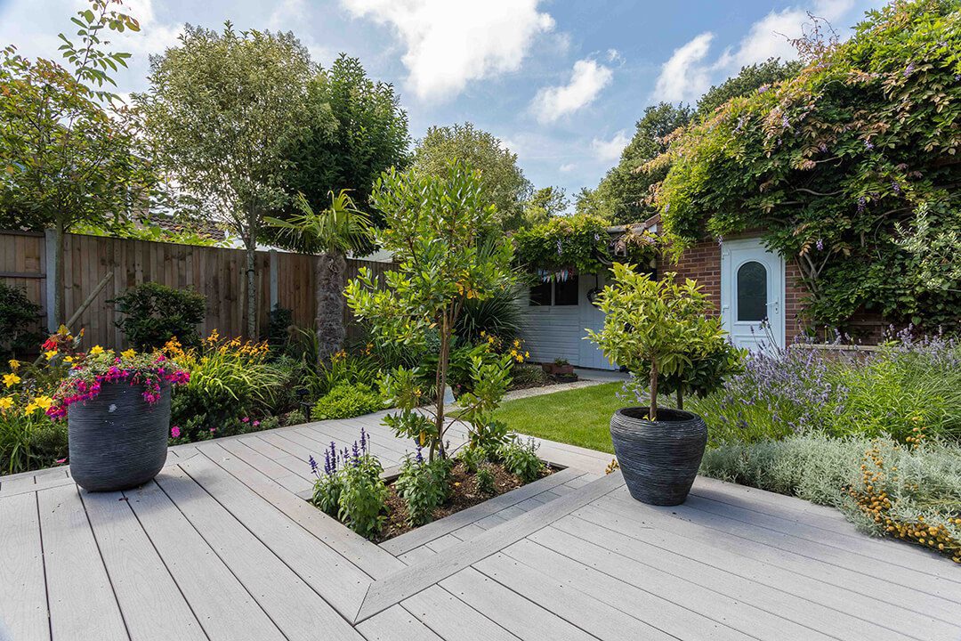 A beautiful coastal inspired garden showing the marine ply decking.