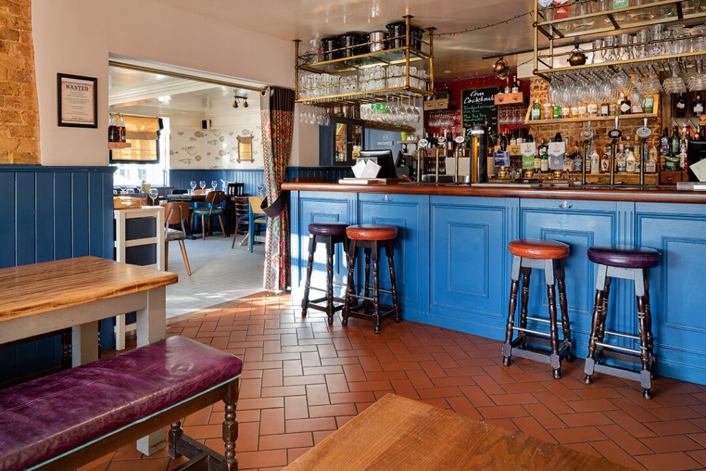 A view across the bar in a Barons Group pub showing the characteristic Barons Blue paint
