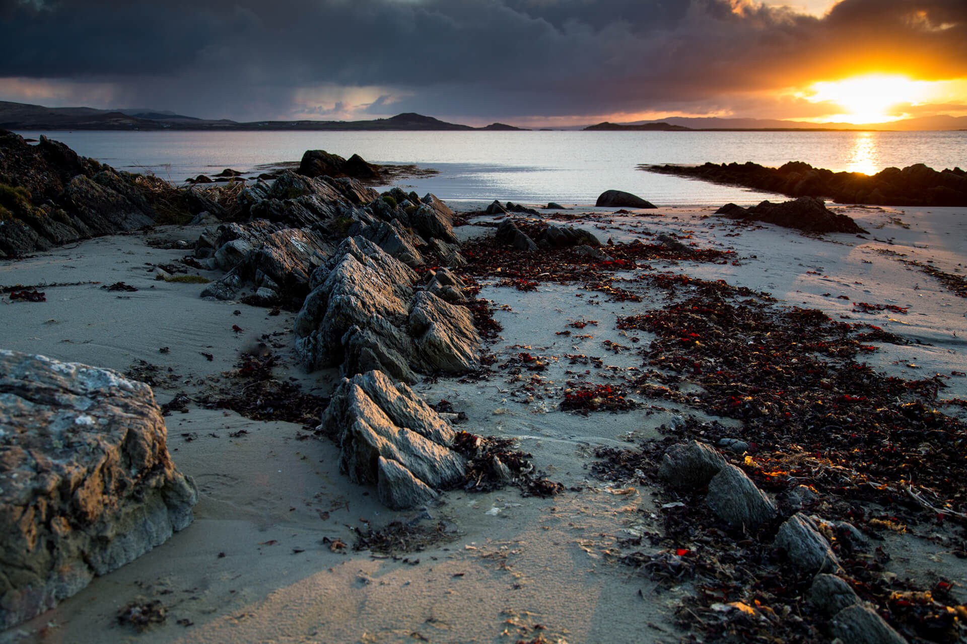Bright sunrise over a picturesque beach on the island of Jura in the Hebrides
