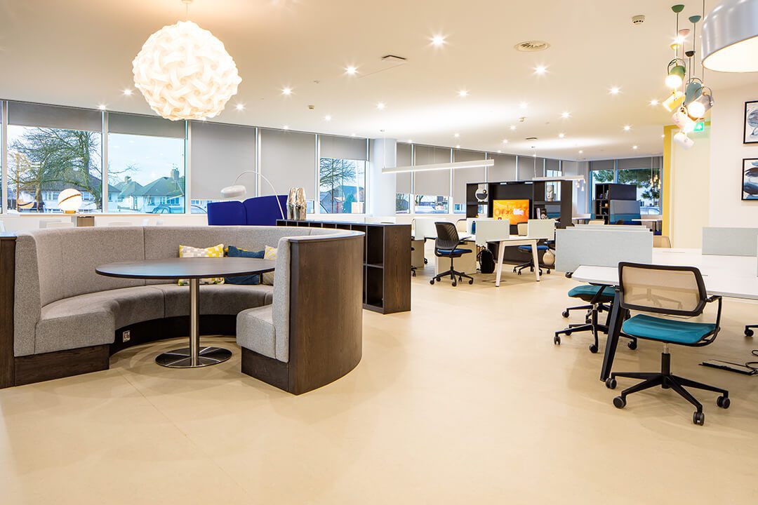 Interior design photography of a breakout area in a contemporary office development featuring an oval seating area