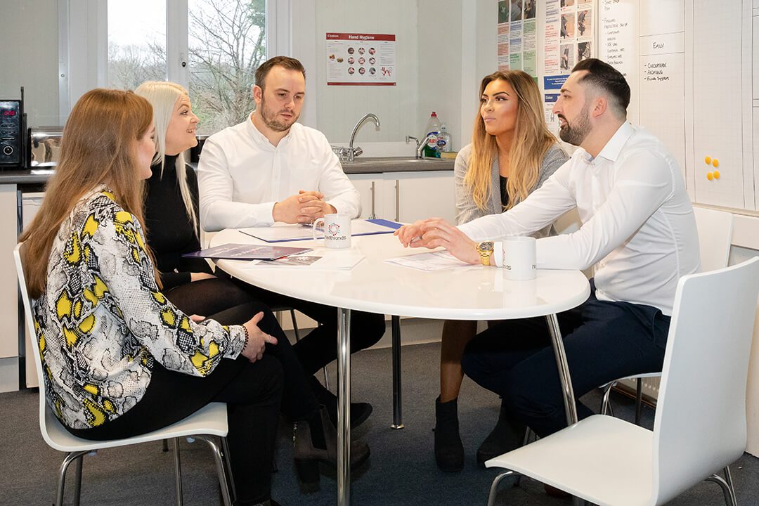 Corporate photography of a meeting being held at a plumbing and heating company