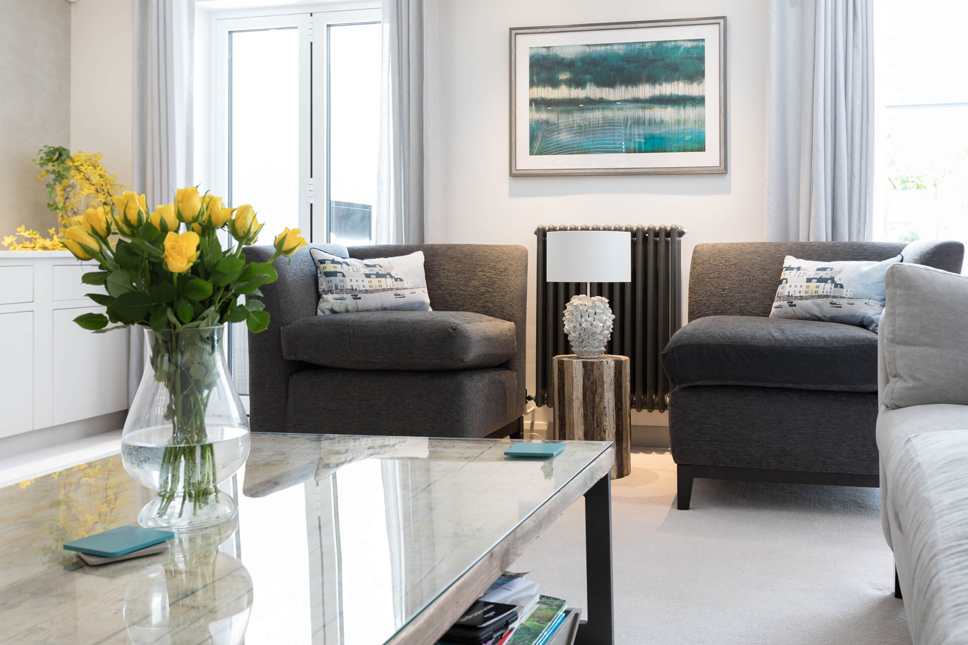 Professional photography of a bright and airy designed sitting room featuring bespoke cushions