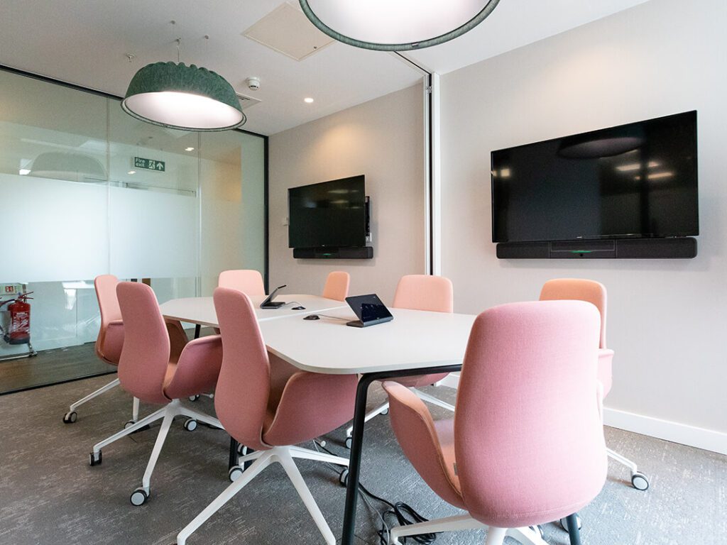 Bright pim=nk furniture as part of a modern office refurbishment.